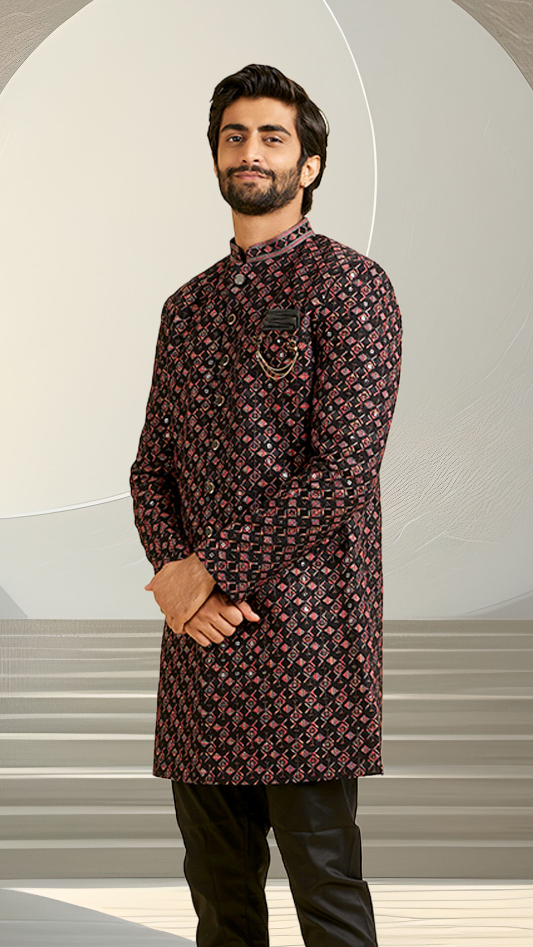 A groom making a bold statement in a vibrant, printed Indo-Western sherwani, blending tradition with contemporary fashion